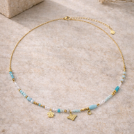 Colgante dorado piedras azules y abeja