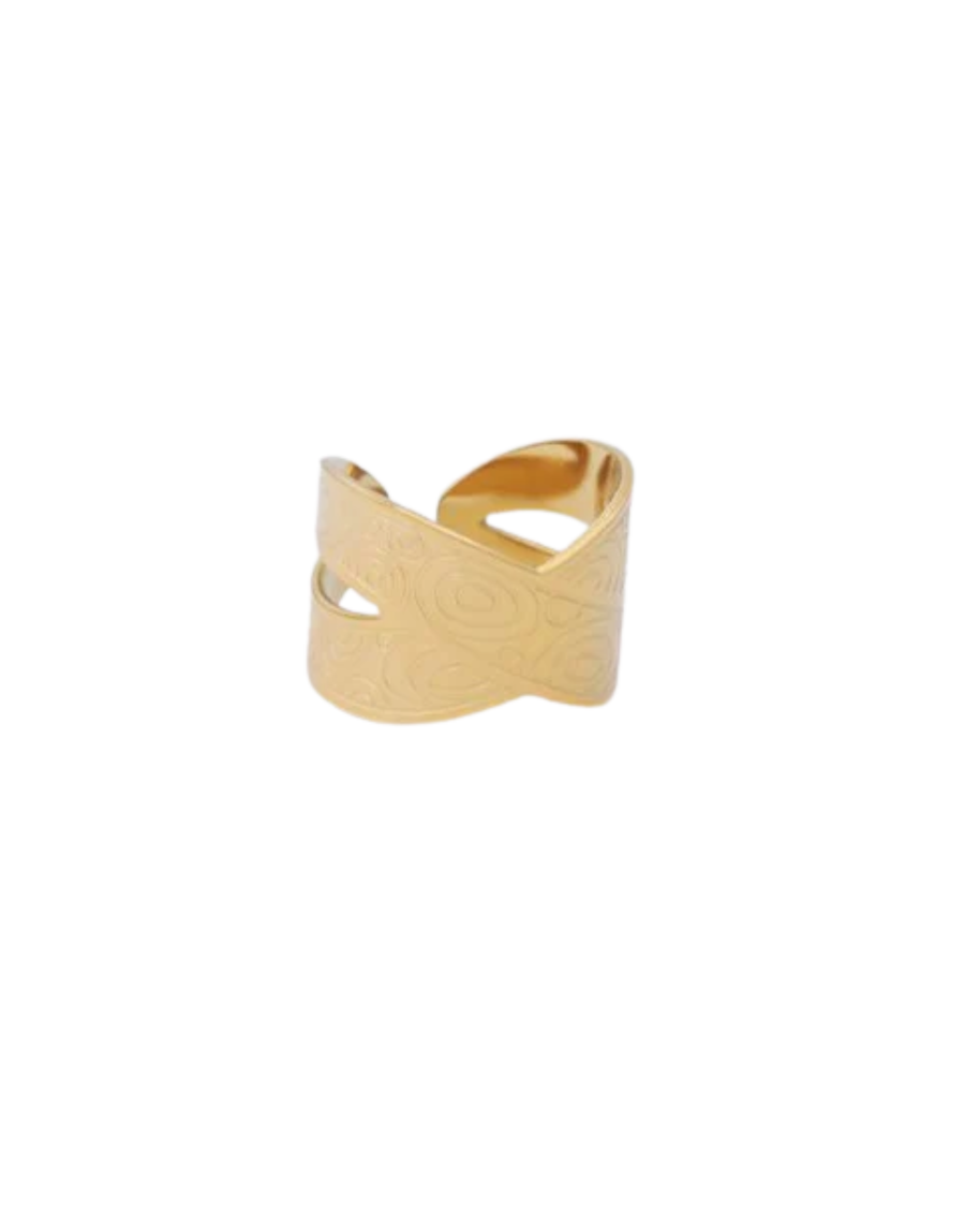 Anillo dorado cruzado con motivos circulares