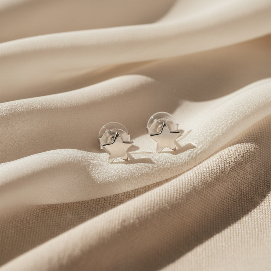 Pendientes estrella plateada