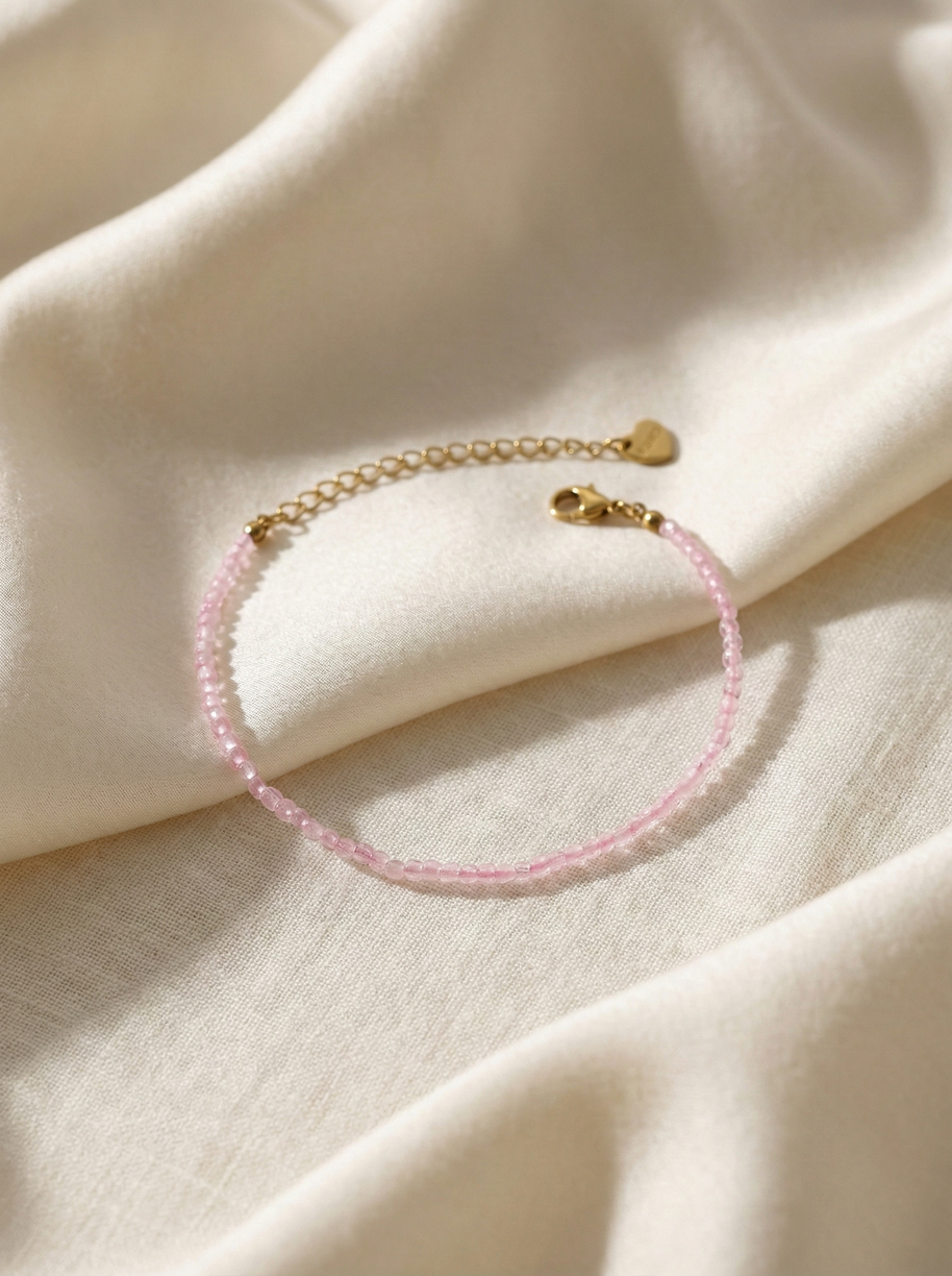 Pulsera dorada piedras rosas