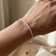 Pulsera dorada piedras rosas