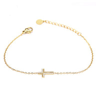 Pulsera dorada con cruz y circonitas