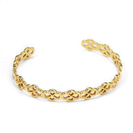 Pulsera tipo brazalete dorado de aros de flores.