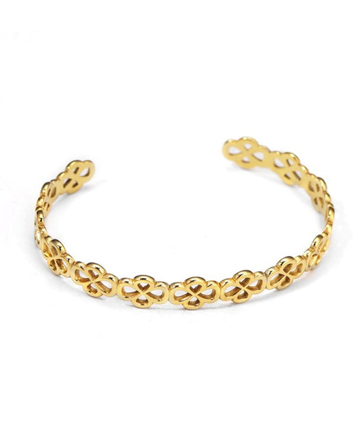 Pulsera rígida dorada de aros de flores